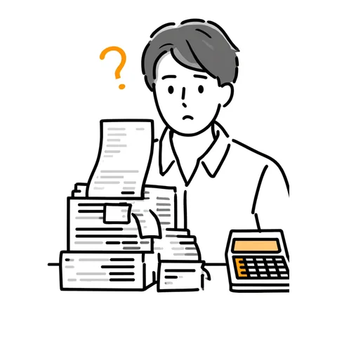 書類の山と電卓を前に困る担当者