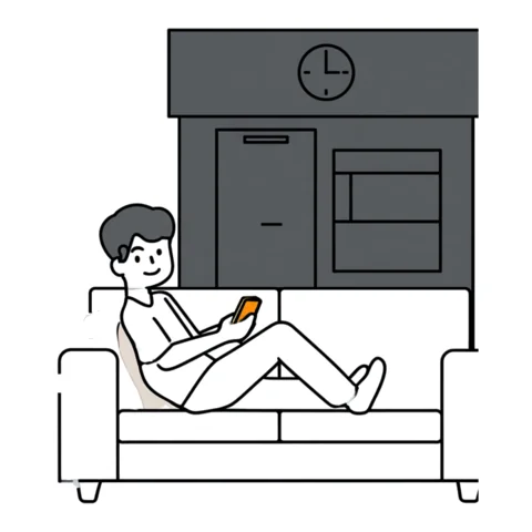 夜、ソファでスマホを見ている人
